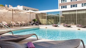Outdoor pool, open 7:00 AM to 10:00 PM, pool umbrellas, pool loungers