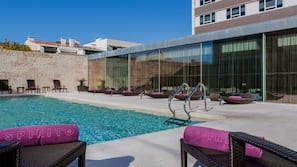 Outdoor pool, open 7:00 AM to 10:00 PM, pool umbrellas, pool loungers