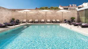 Outdoor pool, open 7:00 AM to 10:00 PM, pool umbrellas, pool loungers