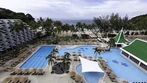 2 outdoor pools, open 7:00 AM to 8:00 AM, pool umbrellas, pool loungers