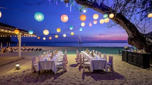 On the beach, white sand, sun-loungers, beach umbrellas