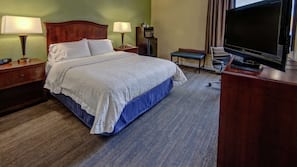 Premium bedding, desk, laptop workspace, blackout drapes