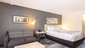 Premium bedding, desk, laptop workspace, blackout drapes
