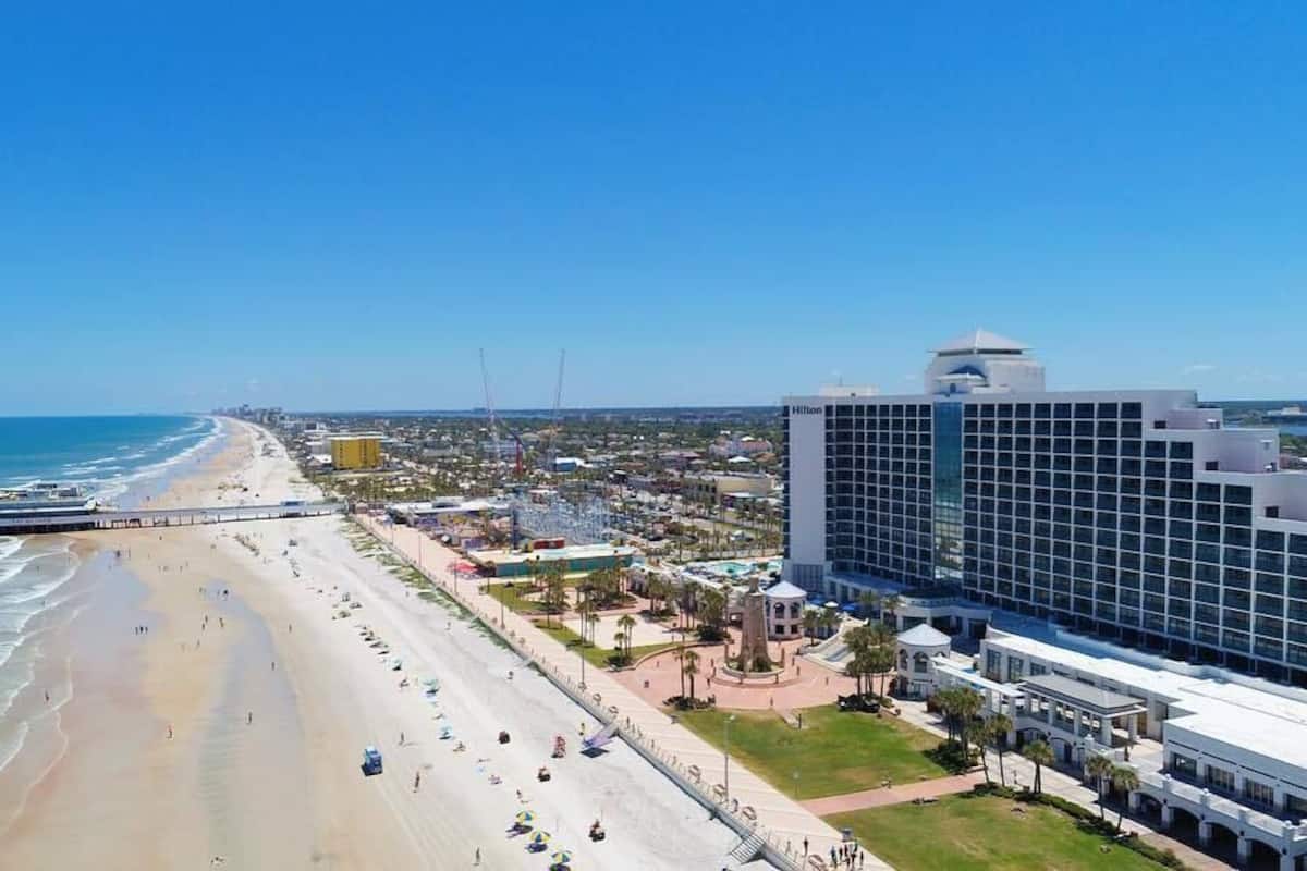 On the beach, white sand, sun loungers, beach umbrellas