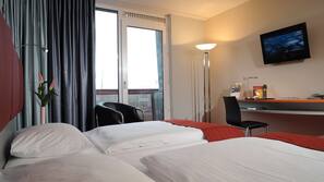 Hypoallergeen beddengoed, een minibar, een kluis op de kamer, een bureau