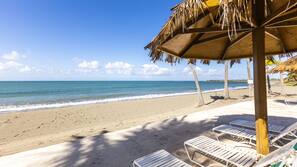 On the beach, sun loungers, beach umbrellas, beach towels