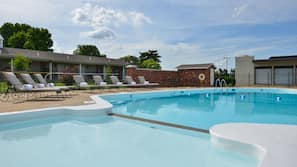 Seasonal outdoor pool, open 10:00 AM to 10:00 PM, pool umbrellas