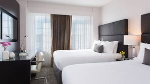 Frette Italian sheets, premium bedding, Tempur-Pedic beds, minibar