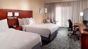 Premium bedding, desk, laptop workspace, iron/ironing board