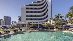 Outdoor pool, open 6 AM to 9 PM, pool umbrellas, pool loungers