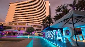Outdoor pool, open 6 AM to 9 PM, pool umbrellas, pool loungers