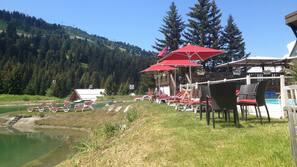 Seasonal outdoor pool, pool umbrellas, pool loungers