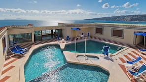 Seasonal outdoor pool, open 10:30 AM to 6:30 PM, pool umbrellas