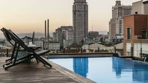 Seasonal outdoor pool, pool umbrellas, pool loungers