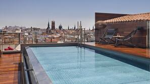 Seasonal outdoor pool, pool umbrellas, pool loungers