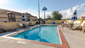 Seasonal outdoor pool, open 9:00 AM to 10:00 PM, pool umbrellas