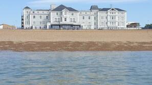 On the beach, rowing