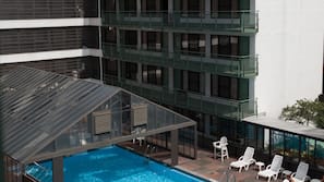 Seasonal outdoor pool, pool loungers
