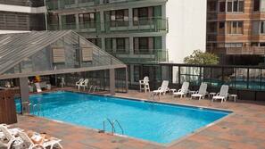 Seasonal outdoor pool, pool loungers