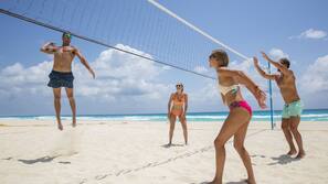 On the beach, white sand, sun loungers, beach umbrellas