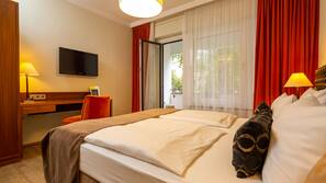 Premium bedding, desk, laptop workspace, blackout curtains