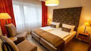 Premium bedding, desk, laptop workspace, blackout curtains