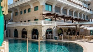 Indoor pool, outdoor pool, open 11:00 AM to 7:00 PM, pool umbrellas