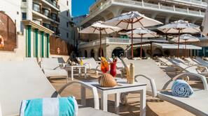Indoor pool, outdoor pool, open 11:00 AM to 7:00 PM, pool umbrellas
