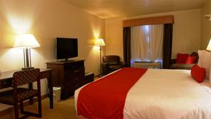 Premium bedding, desk, laptop workspace, blackout drapes
