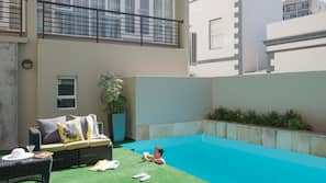 Outdoor pool, pool umbrellas, sun loungers