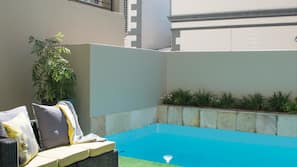 Outdoor pool, pool umbrellas, sun loungers