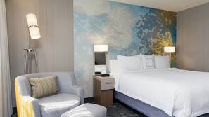 Hypo-allergenic bedding, desk, laptop workspace, blackout drapes