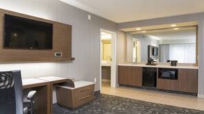 Hypo-allergenic bedding, desk, laptop workspace, blackout drapes