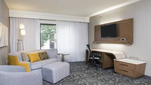 Hypo-allergenic bedding, desk, laptop workspace, blackout drapes