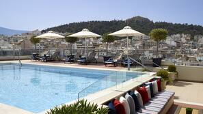 Seasonal outdoor pool, pool umbrellas, pool loungers