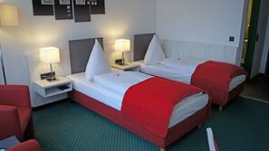 Ropa de cama hipoalergénica, minibar, escritorio y cortinas opacas