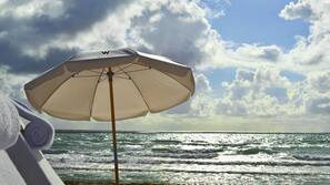 On the beach, beach cabanas, sun-loungers, beach umbrellas
