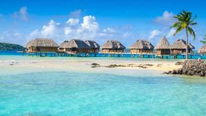 Private beach, white sand, sun loungers, beach umbrellas