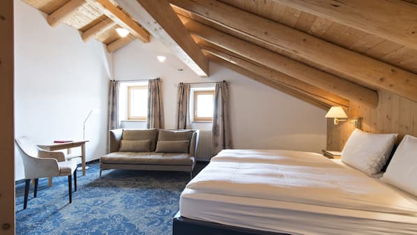 Premium bedding, down comforters, minibar, in-room safe