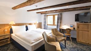Premium bedding, down comforters, minibar, in-room safe