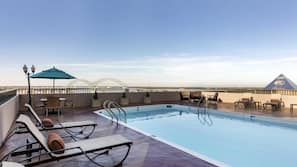 Seasonal outdoor pool, open 7:00 AM to 10:00 PM, sun loungers