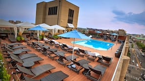 Seasonal outdoor pool, cabanas (surcharge), pool umbrellas