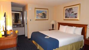 Hypo-allergenic bedding, desk, laptop workspace, blackout drapes