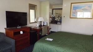 Hypo-allergenic bedding, desk, laptop workspace, blackout drapes