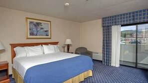 Hypo-allergenic bedding, desk, laptop workspace, blackout drapes