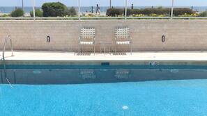Seasonal outdoor pool, open 8:00 AM to 8:00 PM, pool umbrellas