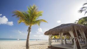 On the beach, beach umbrellas, beach towels, beach bar