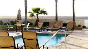 Outdoor pool, open 7 AM to 10 PM, pool umbrellas, pool loungers