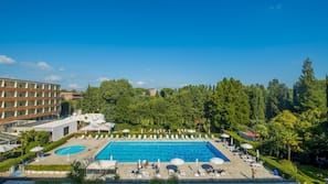 Seasonal outdoor pool, open 10:00 AM to 7:00 PM, pool umbrellas