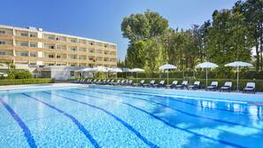 Seasonal outdoor pool, open 10:00 AM to 7:00 PM, pool umbrellas